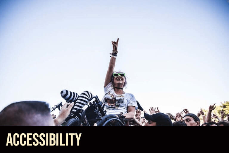 Accessibilty Info - Person in wheelchair crowd surfing