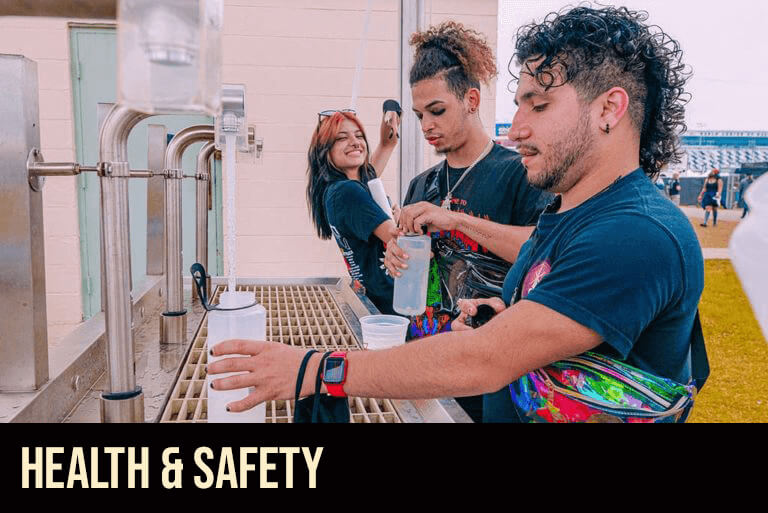 Health & safety image. Concert goers filling up their water bottles.